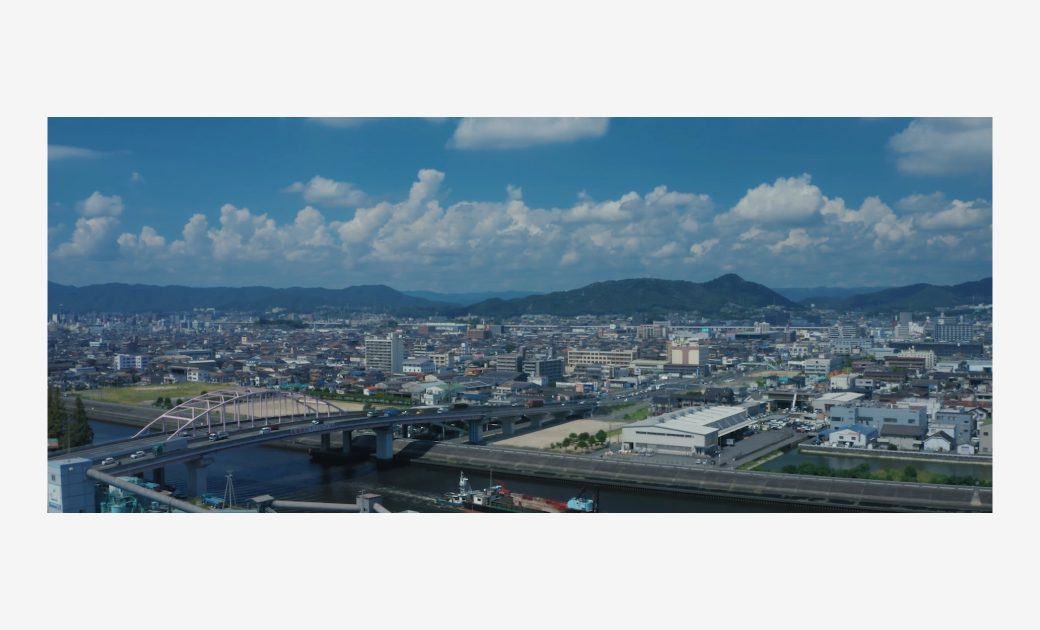 ファーストクリエイト様の社歌動画内の画像で街並みのシーン